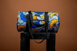 Sac de voyage polochon en wax bleu et jaune avec anses noires