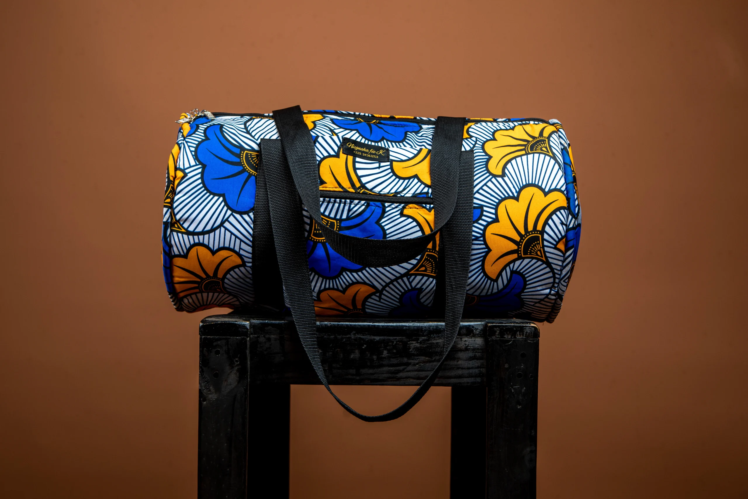 Sac de voyage polochon en wax bleu et jaune avec anses noires
